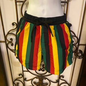 Caribbean inspired swim trunks ! Bright Jamaican theme colors with mesh lining